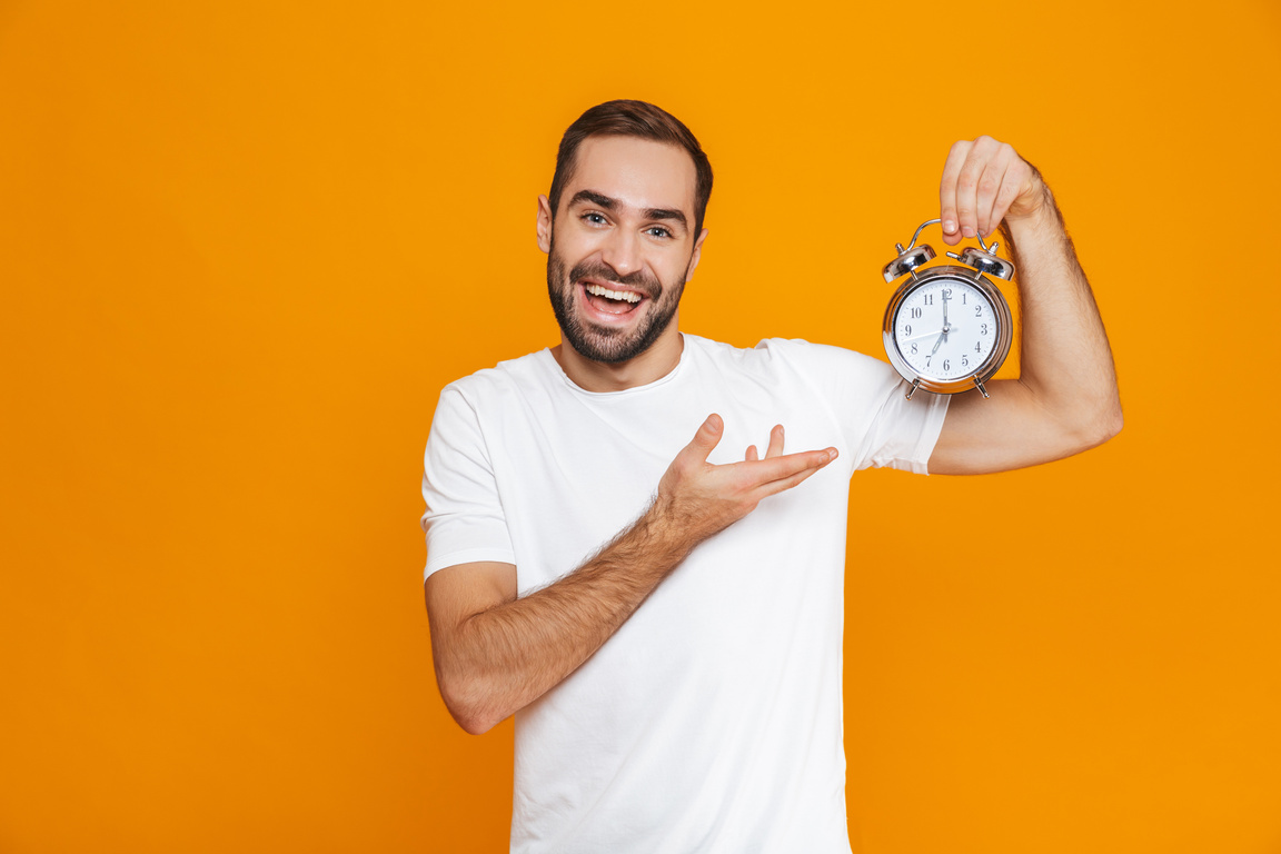 Man Pointing to His Alarm Clock 